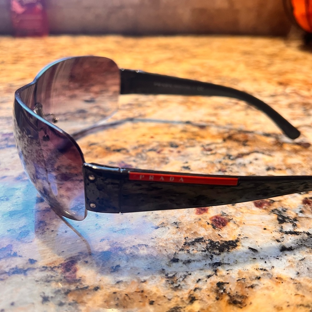 Authentic men’s Prada sunglasses. Used. Fair condition.